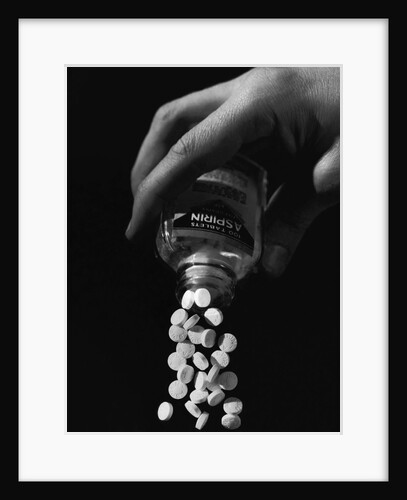Hand Pouring Aspirin from Bottle by Anonymous