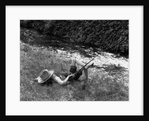 Boy Fishing with Hat Over Face by Anonymous