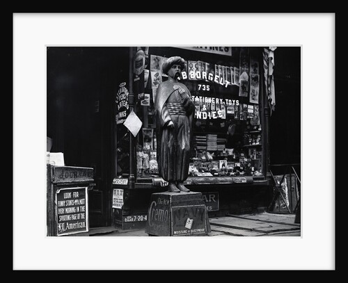 Wooden Statue In Front Of Shop Window by Anonymous
