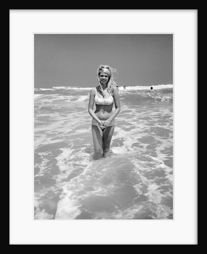 Woman Standing in Ocean Surf by Anonymous