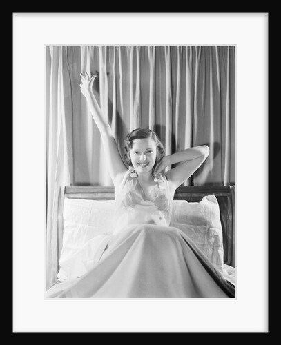 Woman Stretching in Bed by Anonymous