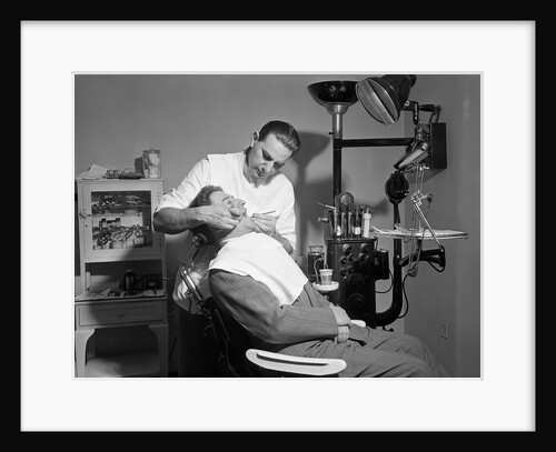 Dentist Working On Patient by Anonymous