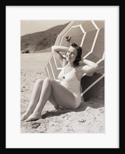 Sunbather Leaning Against Umbrella by Anonymous
