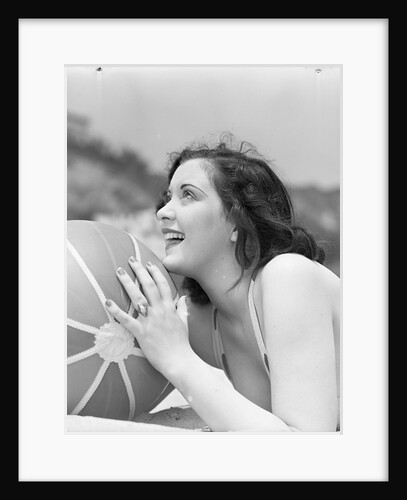 Woman Holding a Beach Ball by Anonymous