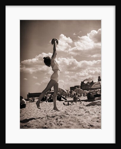 Young Woman Playing Ball On Beach by Anonymous