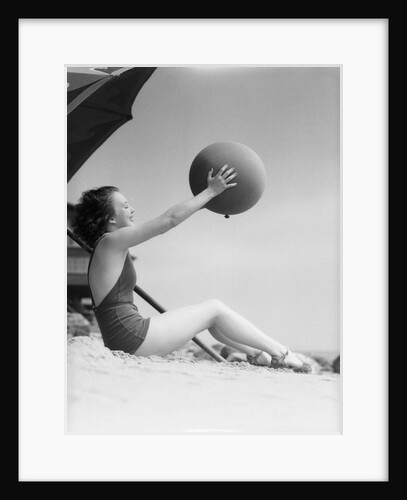 Young Woman Playing With Beach Ball by Anonymous