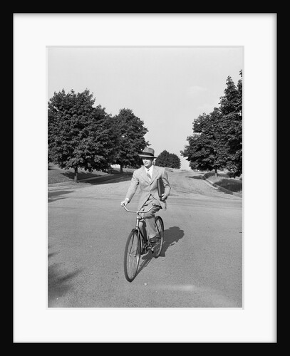 Man in Suit Riding Bicycle by Anonymous