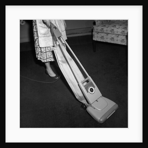Woman Vacuuming by Anonymous