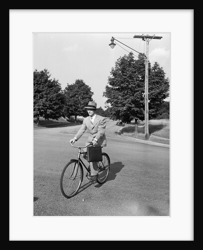 Business Man Riding Bicycle by Anonymous