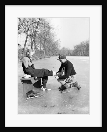 Man Putting on Woman's Ice Skates by Anonymous