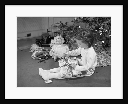 Girl Unwrapping a Gift by Anonymous
