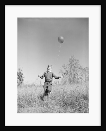 Boy Holding a Balloon by Anonymous