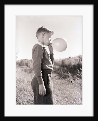 Boy Blowing a Balloon by Anonymous