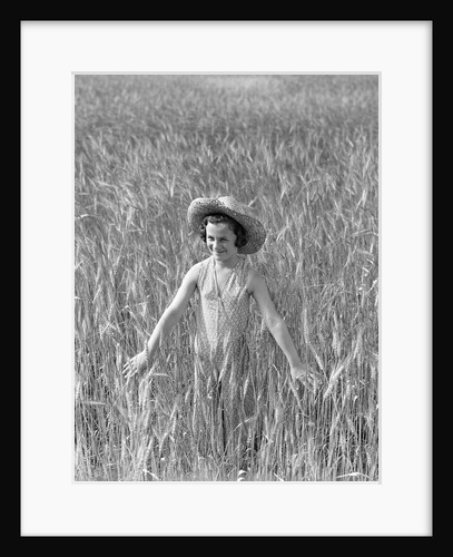 Girl Standing in Wheat Field by Anonymous