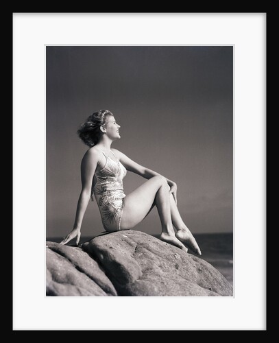 Young Woman in Swimsuit Seated on Rock by Anonymous