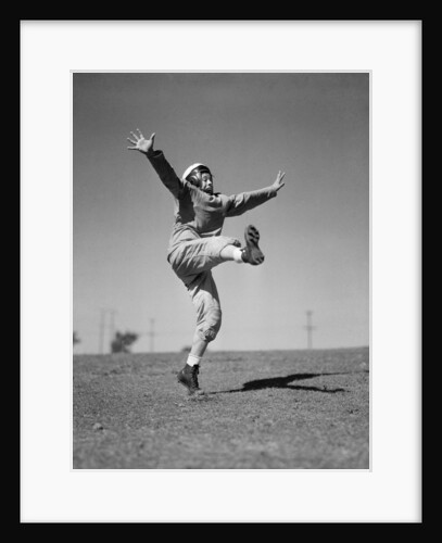 Boy Kicking a Football by Anonymous