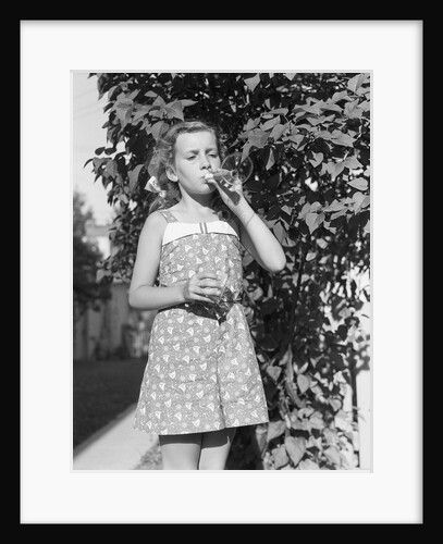 Girl Blowing Soap Bubbles by Anonymous
