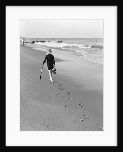 Woman Walking on Beach Leaving Footprints by Anonymous