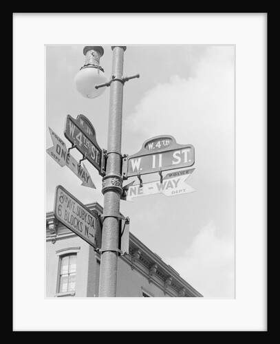 Street Light With Signs by Anonymous