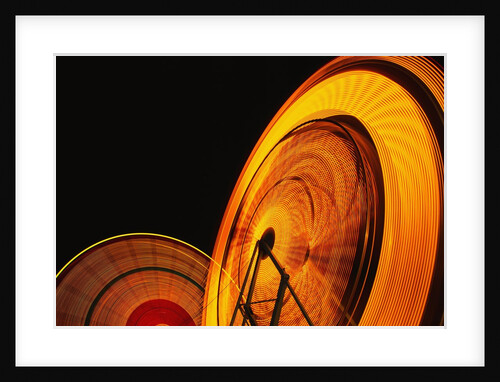 Spinning Ferris Wheels at Night by Anonymous