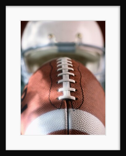 Football and Football Helmet by Anonymous