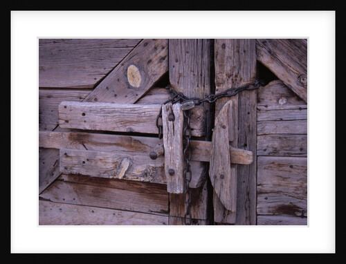 Chains and Lock on Weathered Barn Door by Anonymous