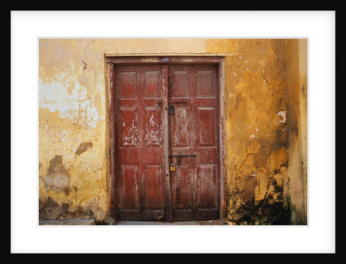 Wooden Door in Worn Wall by Anonymous