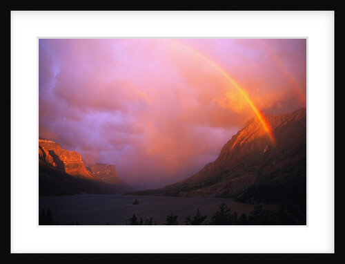 Rainbow and Clouds over a Valley by Anonymous