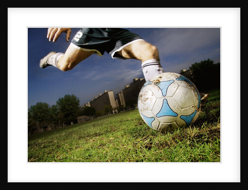 Soccer Player Kicking Ball by Anonymous