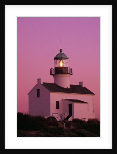 Lighthouse Against a Pink Sky at Twilight by Anonymous