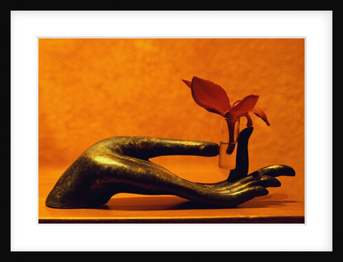 Sculpted Hand Holding Massage Oil Vial by Anonymous