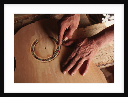 Carving a Guitar Face by Anonymous
