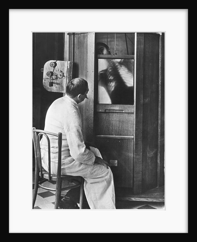 Doctor Using a Fluoroscope by Anonymous