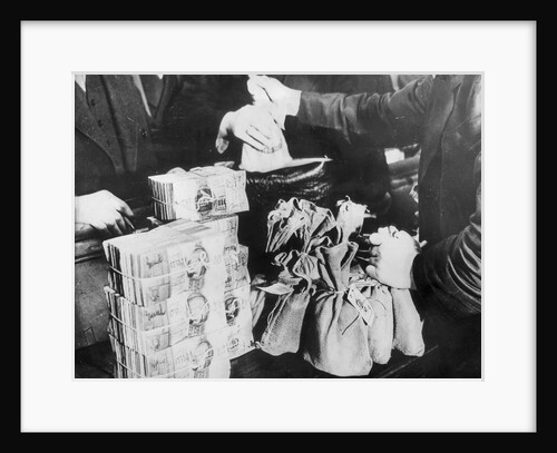 Currency Being Exchanged by Hand by Anonymous