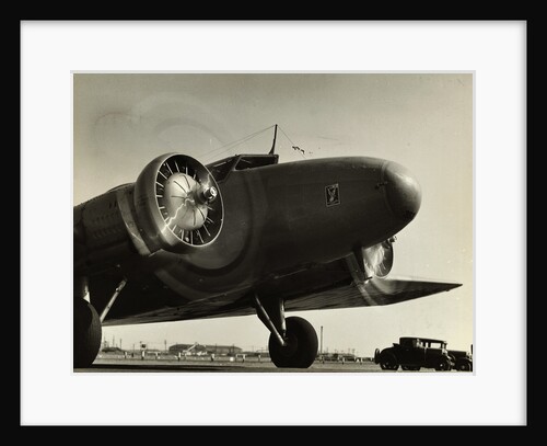 View of Airplane Nose with Propellers Spinning by Anonymous