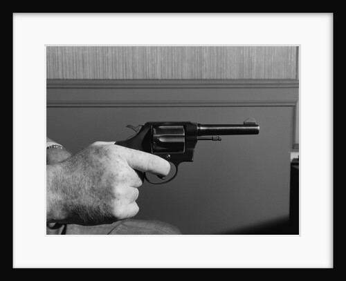 Hand Holding Colt .38 Special Revolver by Anonymous
