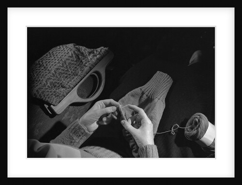 Girl Knitting by Anonymous