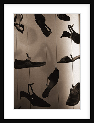 Ladies Shoes Hanging on Wire by Anonymous