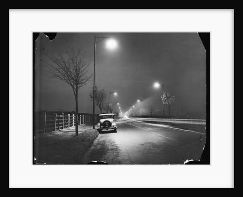 Car on a Lit Road by Anonymous
