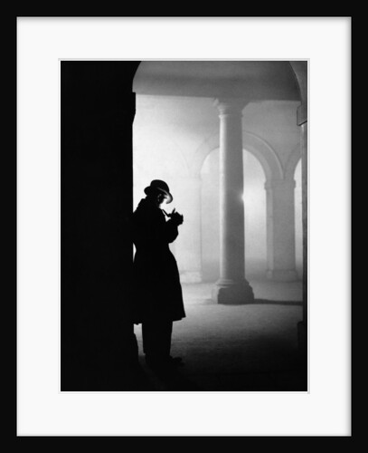 Silhouette of Man Lighting Pipe by Anonymous