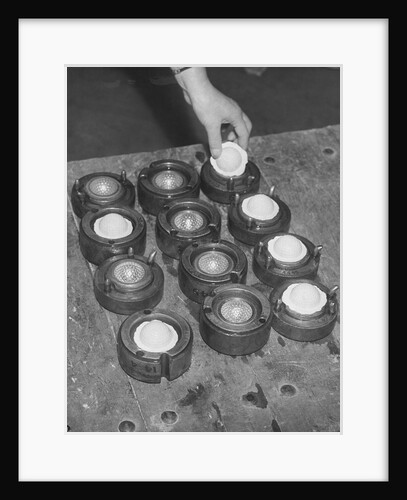 Golf Balls in Molds by Anonymous