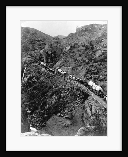 Wagon Train on Mountain Pass by Anonymous