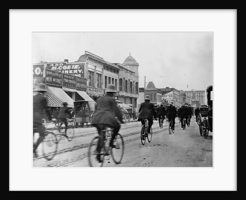 Los Angeles Police Officers Bicycling Past Broadway Storefronts by Anonymous