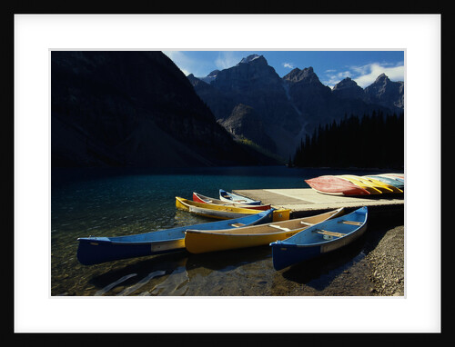 Canoes at Moraine Lake in Banff by Anonymous