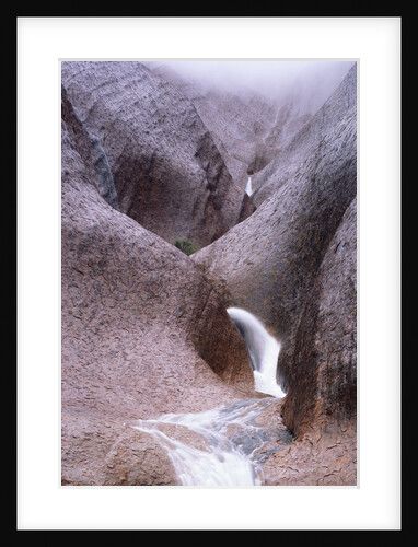Water Cascading from Ayers Rock by Anonymous