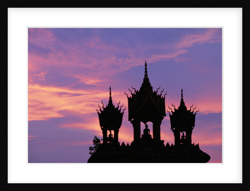 Sunset at Pha That Luang Gate in Laos by Anonymous