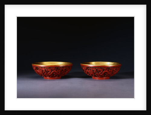 A Pair of Carved Red Lacquer Dragon Bowls by Anonymous