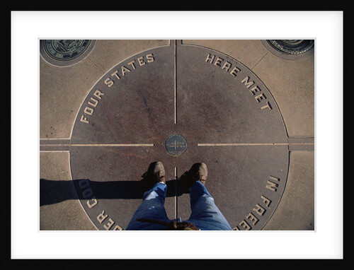 Tourist Standing on Four Corners Monument by Anonymous