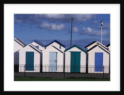 Beach Huts on Devon Town's Waterfront by Anonymous