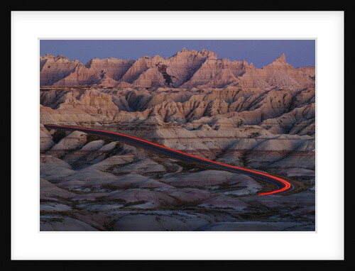 Car Traveling Through Badlands National Park by Anonymous